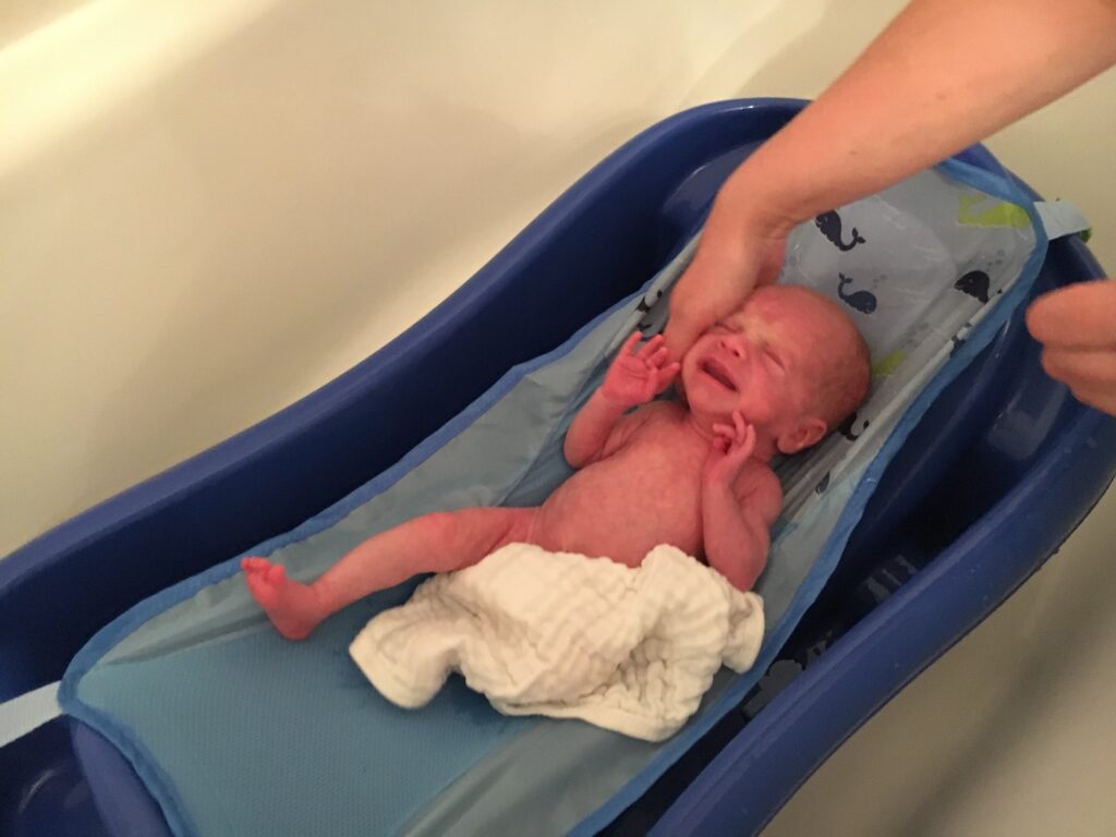 Premature newborn first bath at home from the NICU