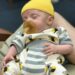 Newborn Preemie With Natursutten Natural Rubber Pacifier and Bee Outfit From Cat & Dogma