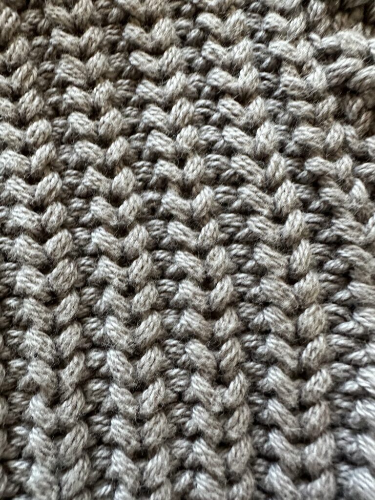 Close up of chunky knit sweater from luxury kids brand hux baby