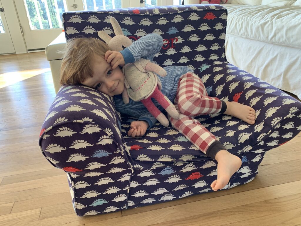 3 Year Old Lounging in the Dinosaur Extended Anywhere Chair