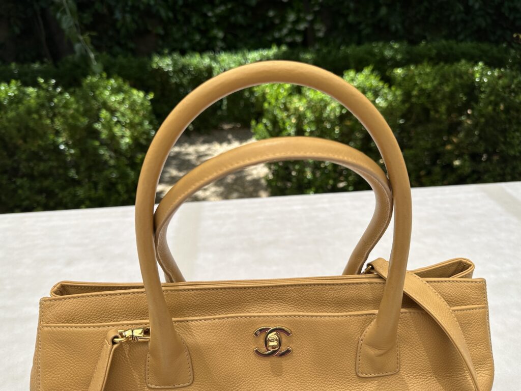 Vintage Chanel Executive Cerf Tote with double CC closure has Versatile rolled Handles that can be hand carried or carried on the crook of your arm.