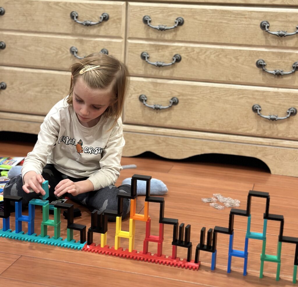 5 Year Old Building with BULK Dominoes a Domino Wall