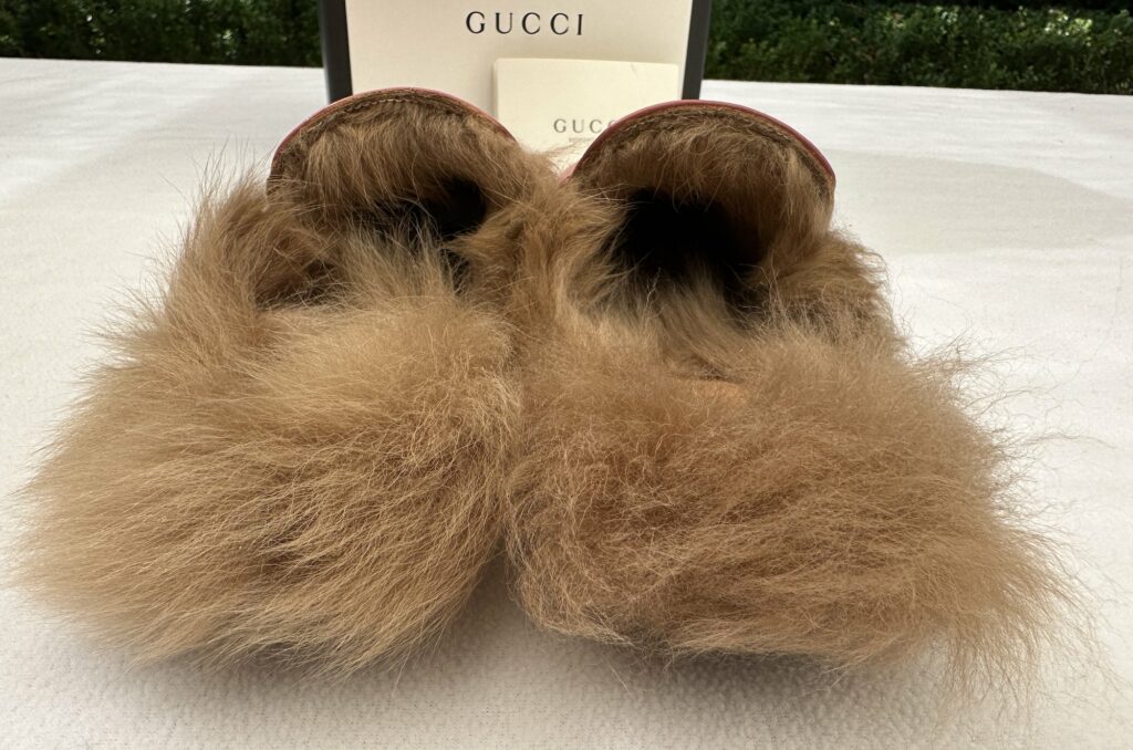 Gucci Fur Princetown Slippers Mules with Furry Trim. The fur stretches inside the toe box and around the insole of the slide.