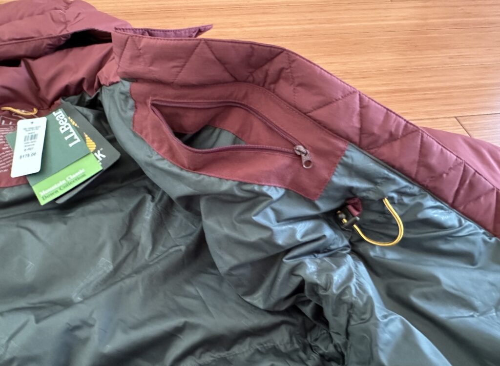 L.L. Bean Features interior zipper pocket big enough for a cellphone, earbuds and other things to keep safe in the winter months. Most LL Bean coats come in petite sizes that fit very well women 5'4" and under 5' 4'11"