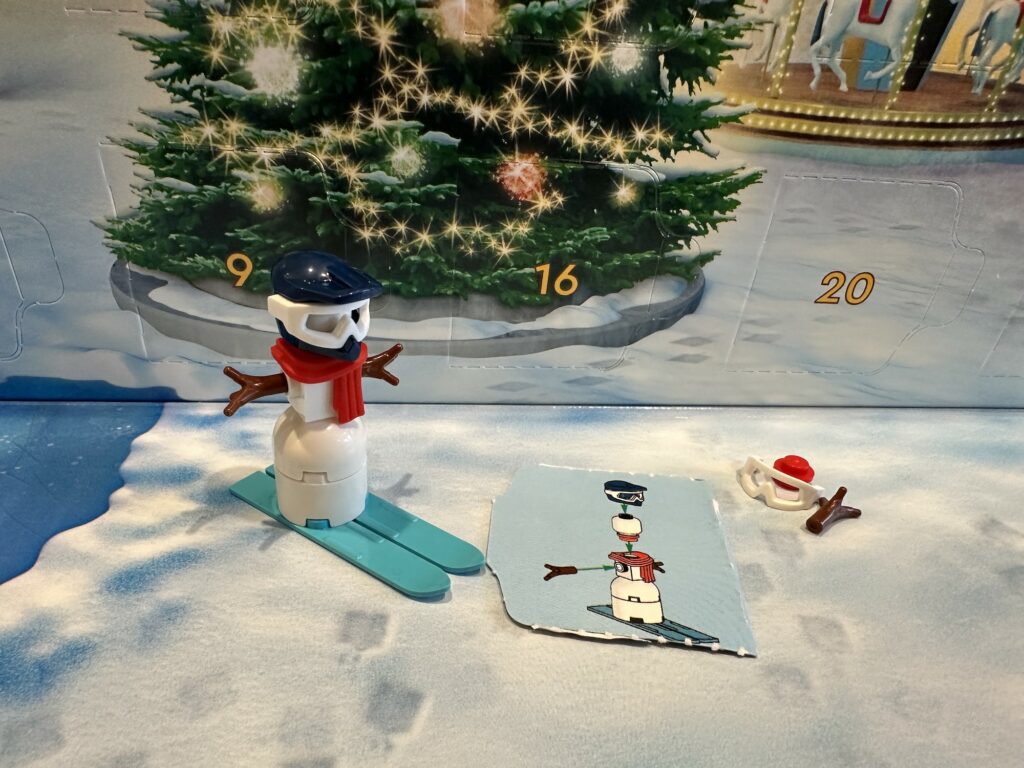 Day 1 Lego City Advent Calendar is a snowman on skis it comes with instructions on the door flap and some extra pieces