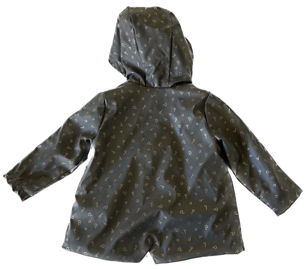 Zara Baby Outerwear Collection Faux Fur Rubberized Rain Coat for Toddlers Back View with mini Vent and super cute alphabet print