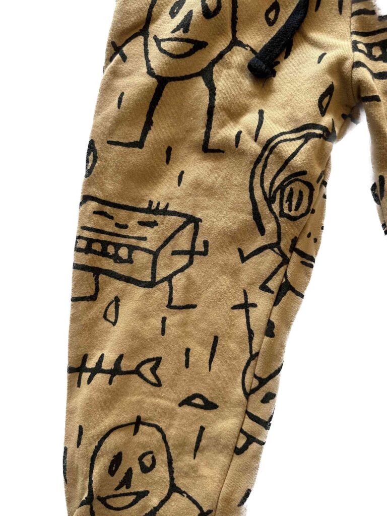 Nununu Crayon Style Kid Childish Drawing Pant Print with Goofy Skulls Close up on the pattern / design