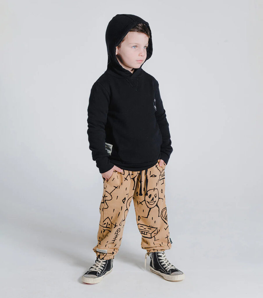 nununu website stock photo of model kid modeling goofy skulls pants