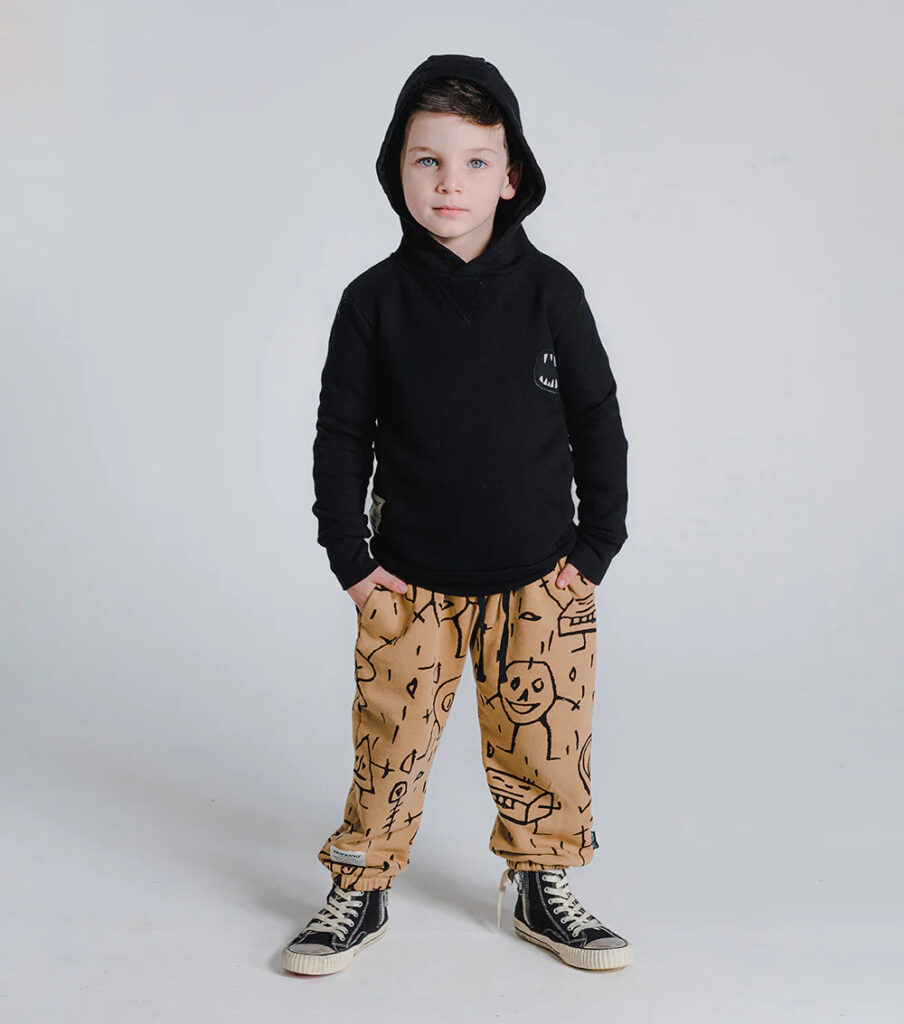 modeling the nununu goofy skull loose relaxed joggers with a black hoodie