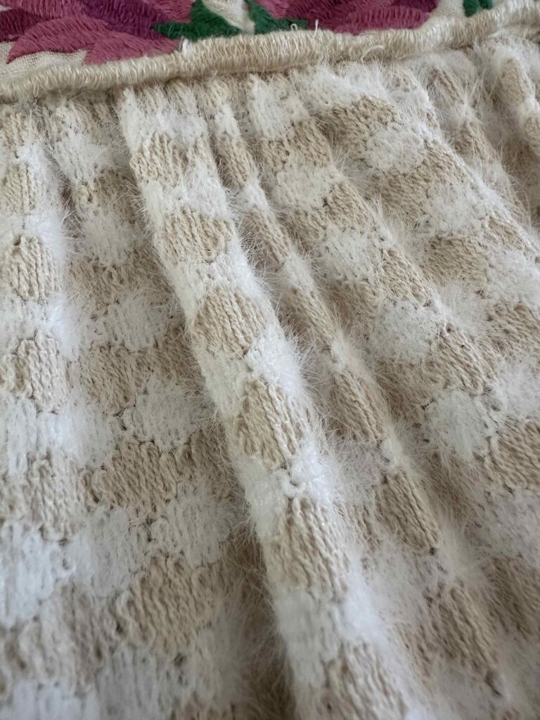 fuzzy fabric on the anthropologie let me be tank top