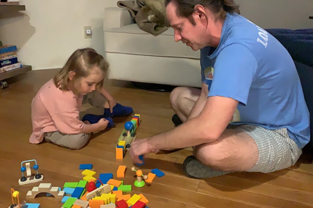 How to Play and Teach Toppling Dominoes with Your Young Child or Toddler a great activity that can start at a young age