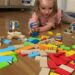 Introducing Toddlers and Little Kids to Their First 1st Wooden Toppling Domino Set from Hape Early Explorer Dynamo Dominoes Game