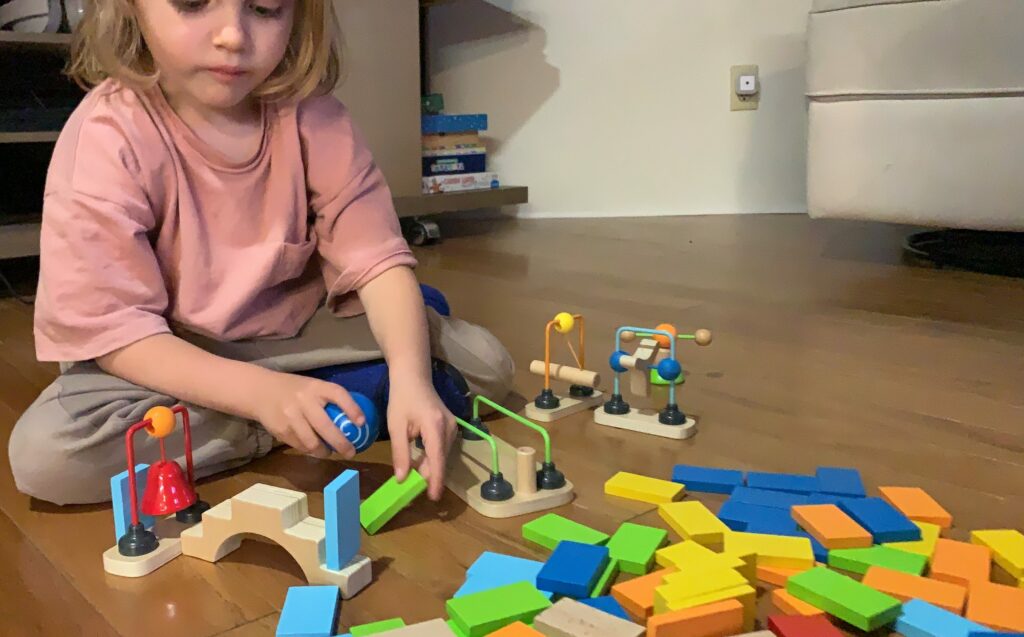 Hape DYNAMO Wooden Domino Set is the Best Toy for Toddler Boys and Girls between the ages of 3 4 5 6 and beyond