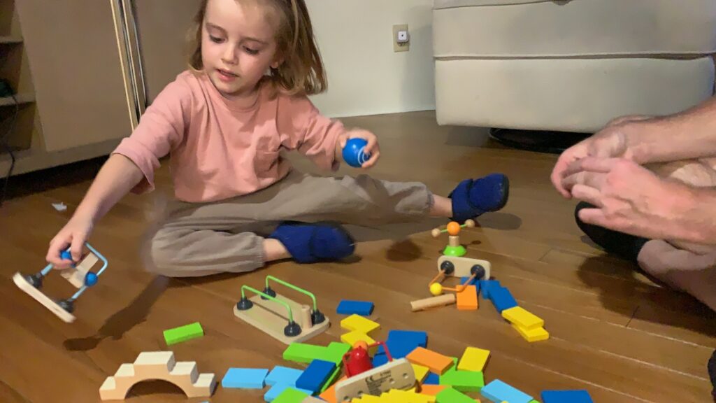 Introducing Toddler Boys and Girls to STEM and STEAM Activities and Games Using Wooden Toppling Dominoes