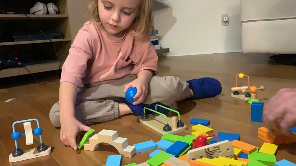 Toddler stacking dominoes