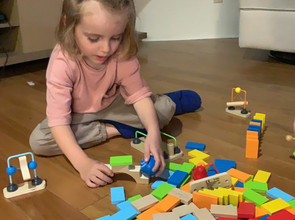 Hand Eye coordination exercises for Toddlers using toppling dominoes