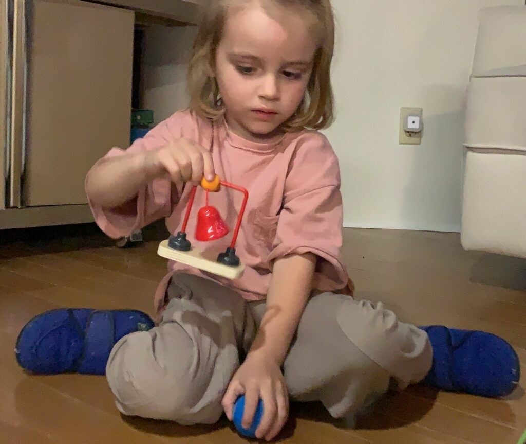 HAPE Dominoes Set with Obstacles including a red metal bell was a hit with toddlers